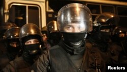 Police officers stand guard near a temporary detention facility where Georgian former President Mikheil Saakashvili was escorted after being detained in Kyiv, Ukraine, Dec. 8, 2017.