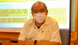 香港民意研究所副行政總裁鍾劍華,對4名年輕人因為參與六四燭光集會,而要受牢獄之災感到難過。(美國之音湯惠芸拍攝)