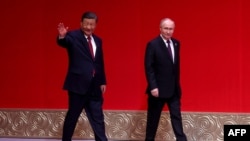 资料照:中国领导人习近平在北京接待到访的俄罗斯总统普京。(2024年5月16日)