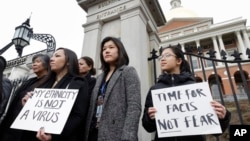 亚裔美国人在新冠病毒流行期间抗议对亚洲社区的种族歧视。(2020年3月12日)