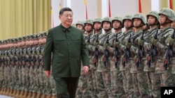 中共中央军委主席习近平检阅驻澳门解放军(资料照:2024年12月20日)