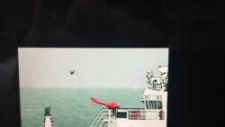 日本海上保安厅公开5月18日在钓鱼岛附近海域拍摄到中国海警船放飞疑似小型无人机的录像(截图)