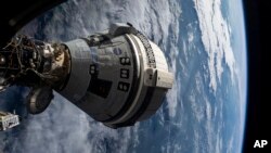 资料照片:2024年7月3日,波音公司的Starliner飞船对接到国际空间站的Harmony舱。(美联社照片)