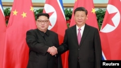 金正恩与习近平2018年5月在大连会面(路透社转载朝鲜中央社照片)