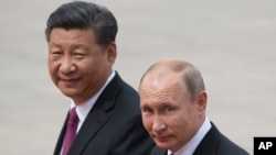 资料照:中国领导人习近平(左)和俄罗斯总统普京