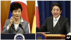 韩国总统朴槿惠(左)和日本首相安倍晋三(右)。
