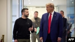 This handout photograph released by the Ukrainian presidential press service on September 27, 2024 shows Ukrainian President Volodymyr Zelensky (L) and Republican presidential nominee former US President Donald Trump meeting on September 27, 2024 in New York.