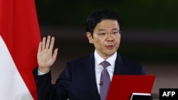 新加坡新总理黄循财在新加坡国家会议中心举行的仪式上宣誓就职。(2024年5月15日)