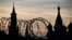 (FILES) This photograph shows a view of the Kremlin taken on May 17, 2023 through the barbed wire of a municipal technical facility in Moscow.
