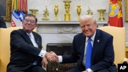 2025年2月7日,唐纳德·特朗普总统在华盛顿白宫椭圆形办公室会晤日本首相石破茂。