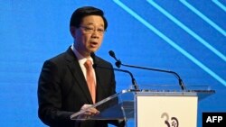 香港特区行政长官李家超2023年11月7日在国际金融领袖投资峰会致辞。(法新社)