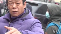 北京便衣人员在法院200米外骚扰采访浦志强案的VOA记者 北京便衣人员在法院200米外骚扰采访浦志强案的VOA记者