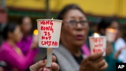 流亡藏人8月19日在达兰萨拉举行烛光晚会,支持香港民众争取民主的抗议活动。