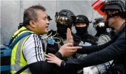 香港记者协会主席陈朗升在2019年“反送中”抗争中进行采访活动。(陈朗升授权使用)