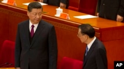 资料照片:中国最高领导人习近平和中国总理李克强出席2019年4月30日举行的纪念五四运动100周年大会。