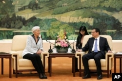 中国总理李克强在北京人民大会堂接见国际货币基金组织总干事拉加德。(2014年3月24日)