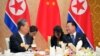 4月11日,中共中央政治局常委、中国全国人大常委会委员长赵乐际(左)与朝鲜劳动党中央政治局常委、最高人民会议常任委员会委员长崔龙海会晤。