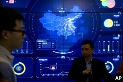 在北京举行的全球移动互联网大会上一幅电子数据显示的中国地图。(2018年7月11日)