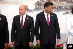 中国国家主席习近平和俄罗斯总统普京在金砖集团五国领导人在厦门金砖峰会上(2017年9月4日)。普京给朝鲜国庆发了贺电,习近平没有发。