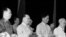 Hà Nội, 1966. Hình minh họa. Hồ Chí Minh (bìa phải), "người nổi lửa nhưng bất an vì viễn cảnh"; và Lê Duẩn (thứ hai từ phải), "đưa đến thống nhất nhưng tạo khủng hoảng toàn diện."