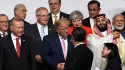 2019年6月28日,中国国家主席习近平与美国总统在日本大阪G20峰会上握手寒暄。(AP图片)