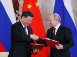 资料照:俄罗斯总统普京与中国国家主席习近平在莫斯科出席协议签署仪式。(2019年6月5日)