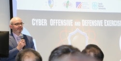 资料照:美国在台协会时任代理处长的谷立言在美台“大规模网络攻防演练”开幕仪式上致辞。(2019年11月4日)