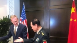时任美国代理防长沙纳汉与中国防长魏凤和2019年5月31日在出席香格里拉对话会期间举行会谈(路透社)