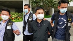 2021年6月17日,香港《苹果日报》总编辑罗伟光(右二)遭警方逮捕,该报另有四名高管也于同日被捕。(AP图片)