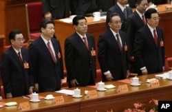 中共十八大闭幕式上的政协主席贾庆林(中)和中纪委书记贺国强(左)、国家副主席习近平、人大委员长吴邦国、国家主席胡锦涛