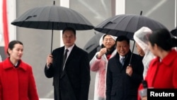 时任上海市长应勇和特斯拉CEO马斯克在上海出席投资50亿美元的特斯拉电动车超级工厂破土动工典礼(路透社2019年1月7日资料照)。
