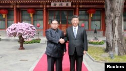中国领导人习近平在北京会见朝鲜领导人金正恩(2018年3月路透社)