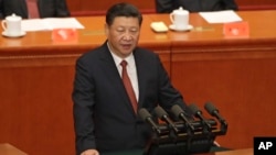 中国国家主席习近平在北京人民大会堂举行的解放军建军90周年大会上发表讲话。(2017年8月1日)