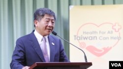资料照:台湾卫福部长陈时中在记者会上