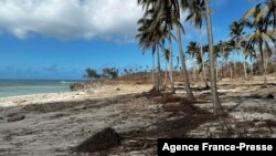 This handout photo released courtesy of Tonga's Minister for Trade and Economic Development on Jan. 20, 2022 shows destruction along the western beaches of Tonga's main island of Tongatapu.