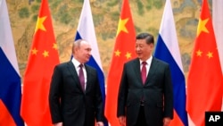 中国国家领导人习近平在北京会晤抵北京出席冬奥会开幕式的俄罗斯总统普京。(2022年2月4日)