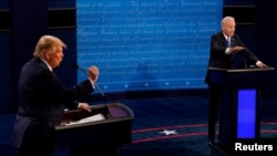 美国总统特朗普与民主党挑战者、前副总统乔·拜登2020年10月22日进行大选前最后一次面对面辩论 (路透社转发媒体联访照片)