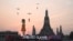 A 12 meter-tall statue of Young-hee, the iconic doll from Netflix's South Korean TV series 'Squid Game,' is seen on a barge in front of Wat Arun temple on the Chao Prayer River ahead of the launch of Season 2, in Bangkok, Thailand, Dec. 19, 2024.