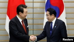 韩国总统尹锡悦2023年3月16日访日首日与首相岸田文雄举行会谈。(路透社)