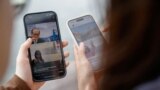 FILE - Users search on the Chinese social media platform Xiaohongshu, in Hong Kong, April 30, 2024.