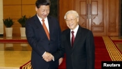11月5日,中国国家主席习近平与越南共产党总书记阮富仲在越南河内会晤。