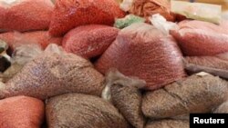 Bags of methamphetamine pills, many seized from Burmese drug mules