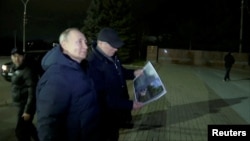 Президент РФ Путін у Маріуполі. Місто, що стало жертвою не лише війни, але і пропагандистської кампанії Росії. 19 березня 2023 р. Фото: Kremlin.ru/Handout via REUTERS