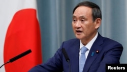 资料照:日本内阁官房长官菅义伟在记者会上讲话。(2019年9月11日)